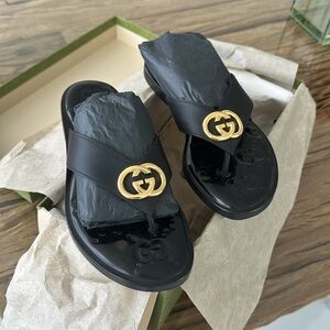 GUCCI
Nadeline logo-embellished leather flip flops